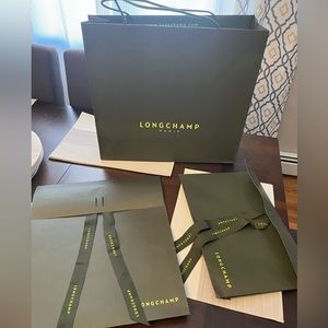 Three Longchamp shopping bags